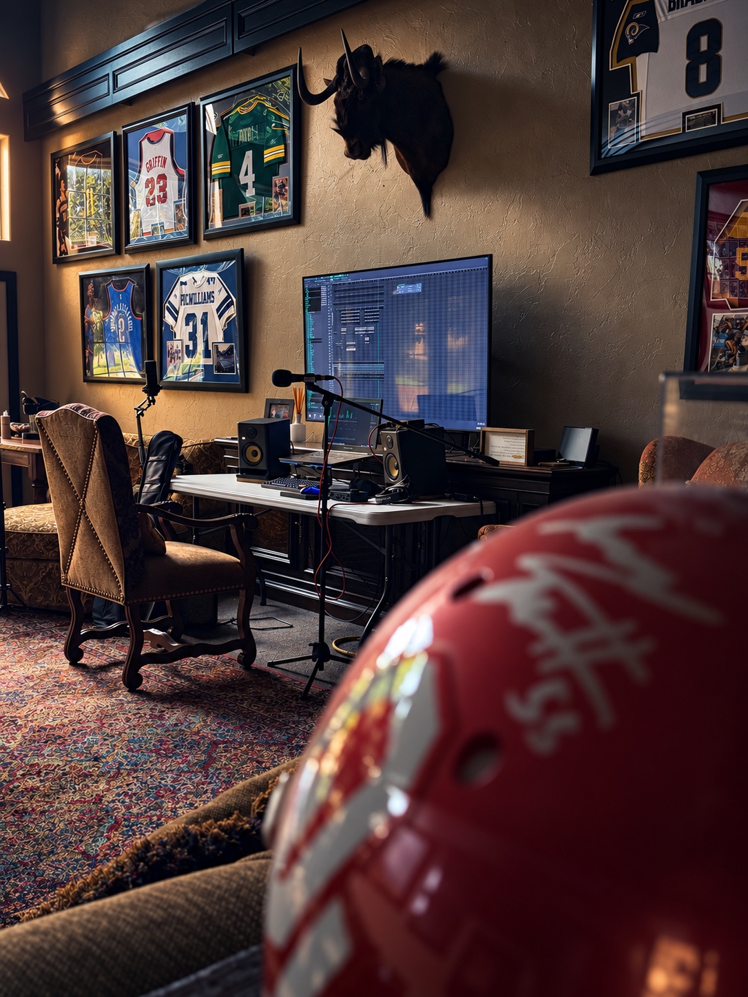 Signed football helmet in the foreground of the OUTONSPACE Studios recording room